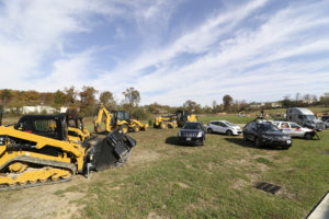 Bulldozers sit around a select group of Torc autonomous vehicles.