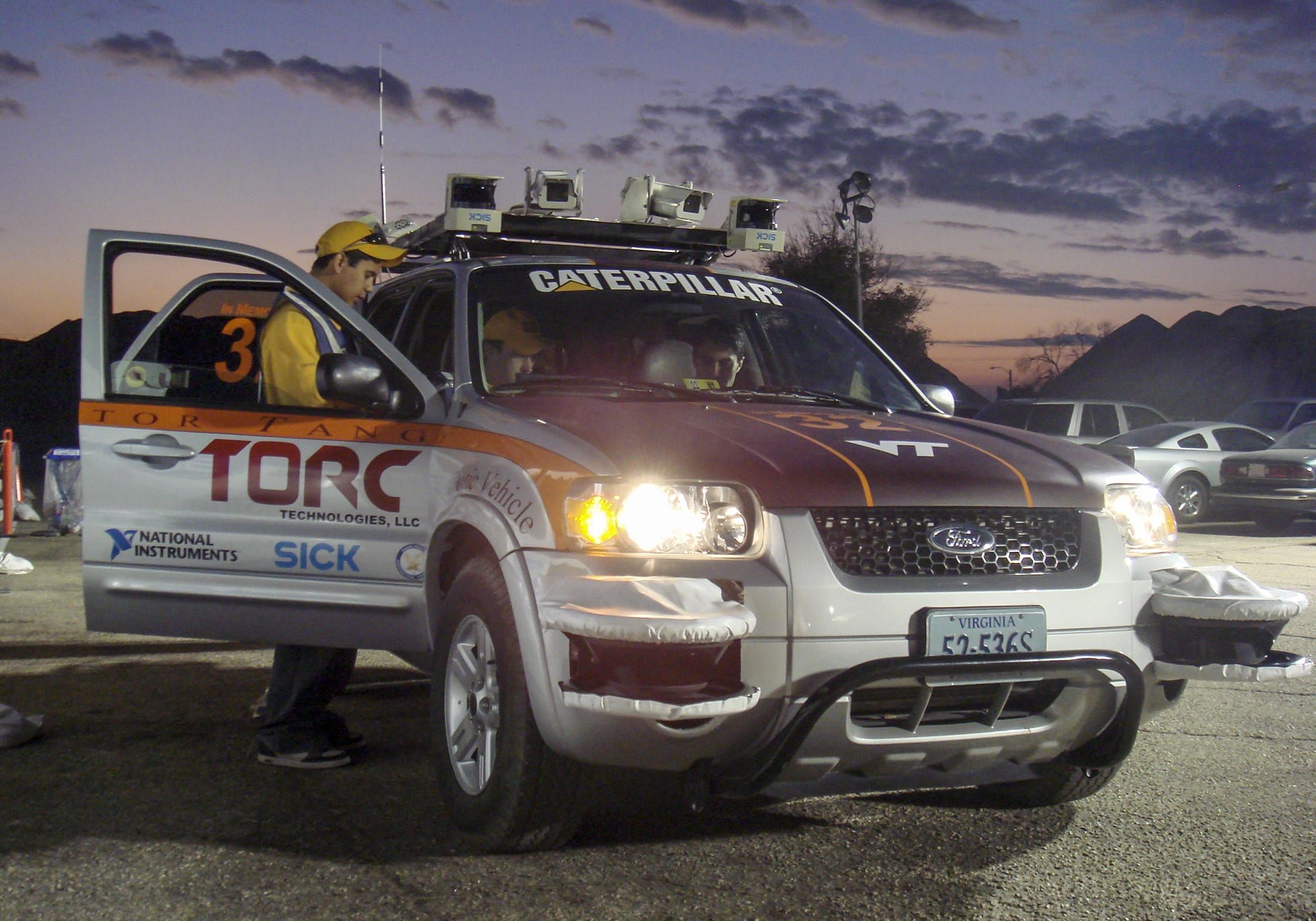 Team members from Victor Tango get their vehicle, Odin, ready for competition at the Darpa Urban Challenge.