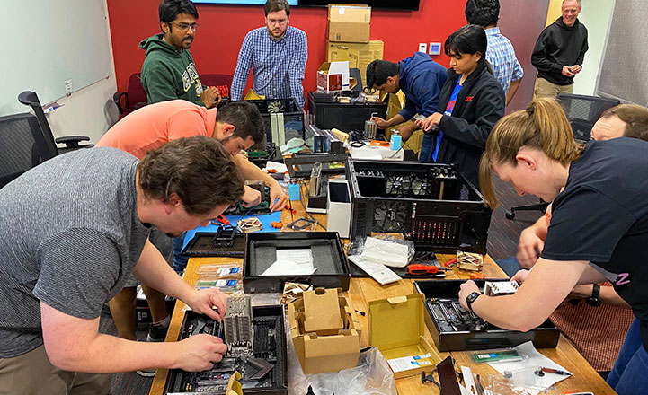 Torc employees building computers together