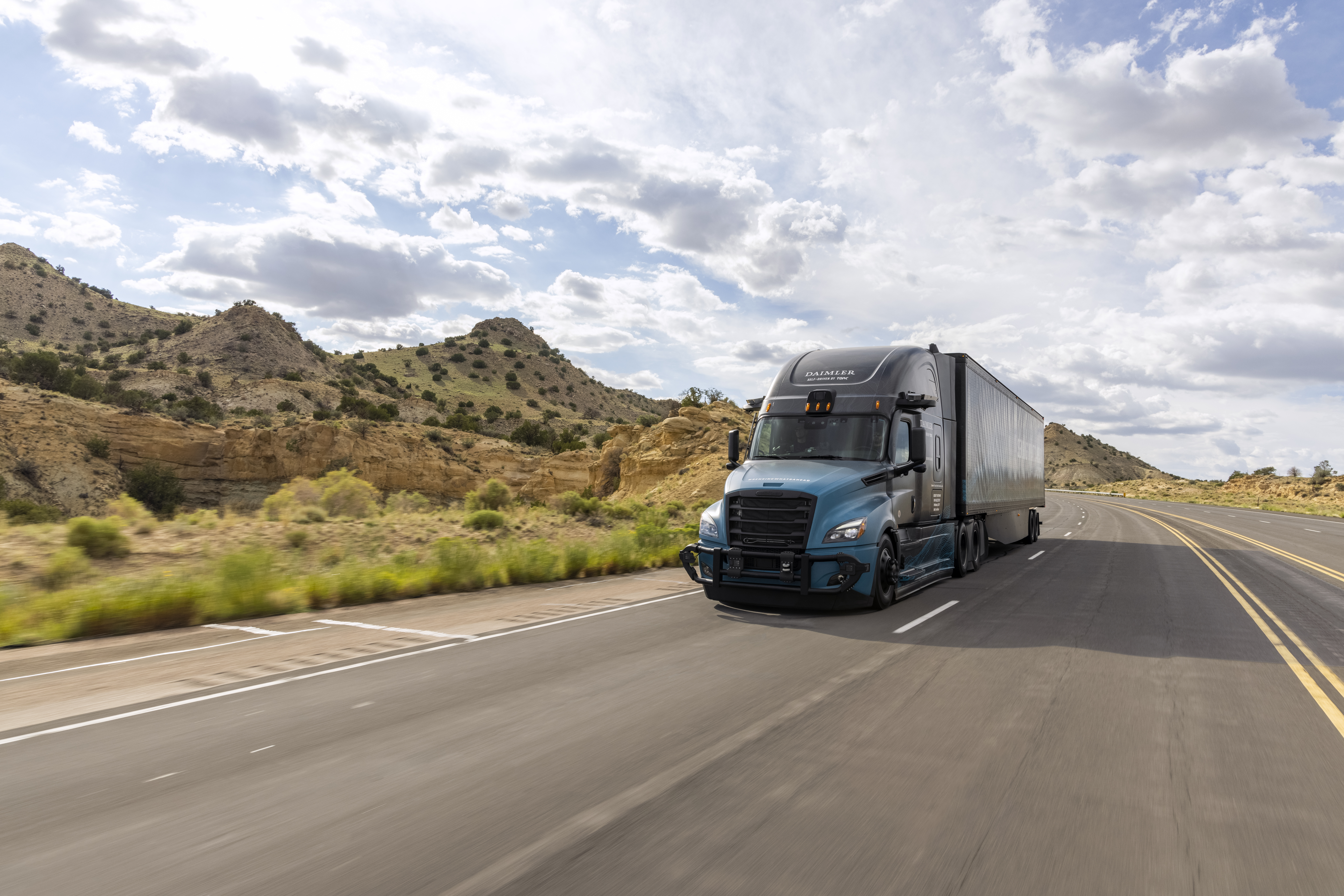 Torc self-driving freight truck driving on highway in desert