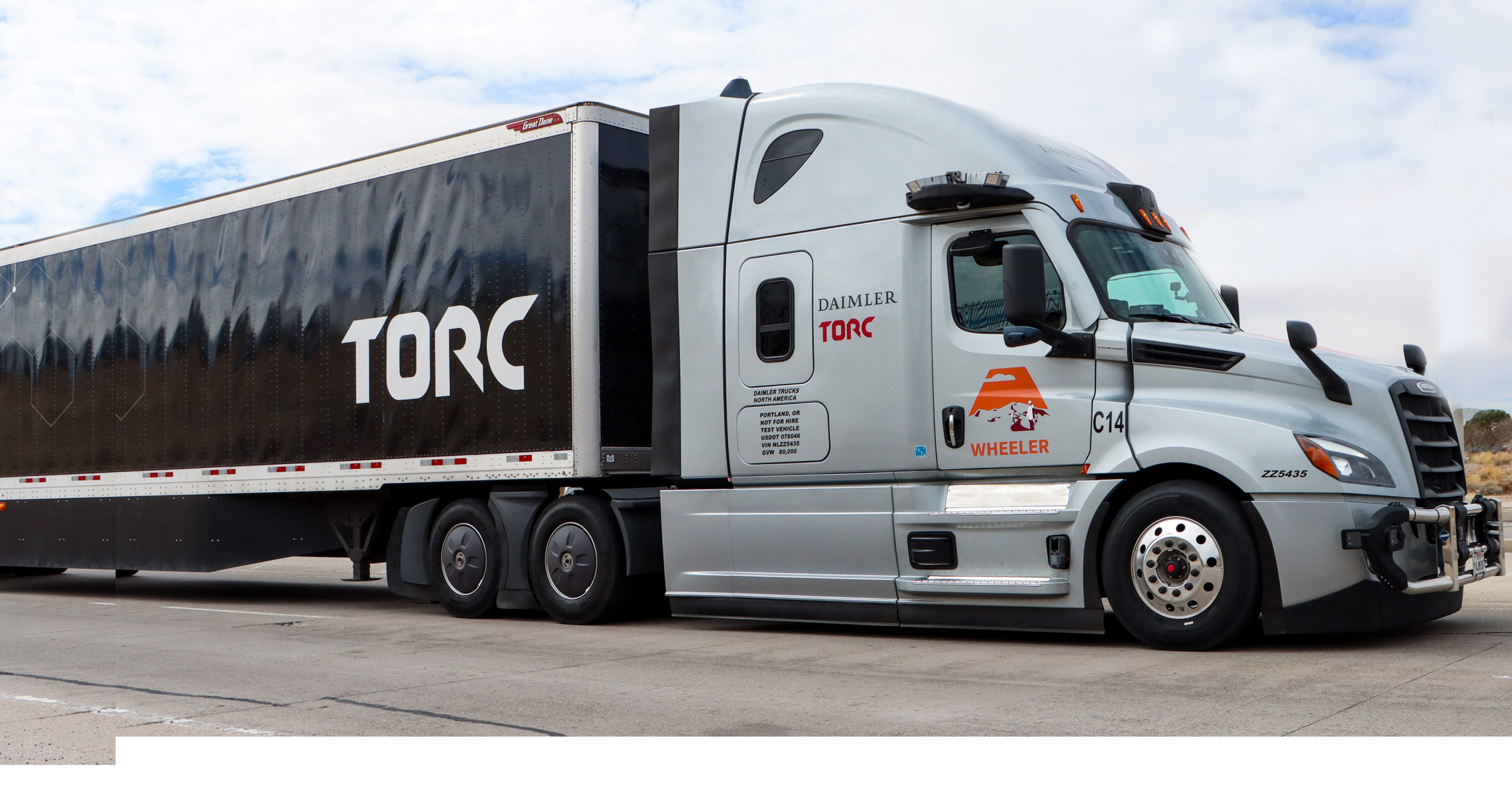 Torc self-driving freight truck driving on highway outside of Albuqerque